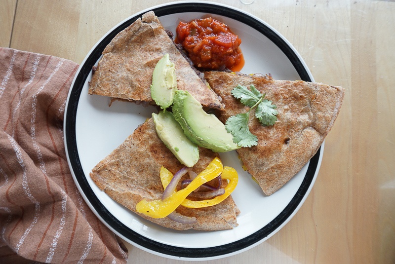 spicy black bean quesadillas with avocado topping