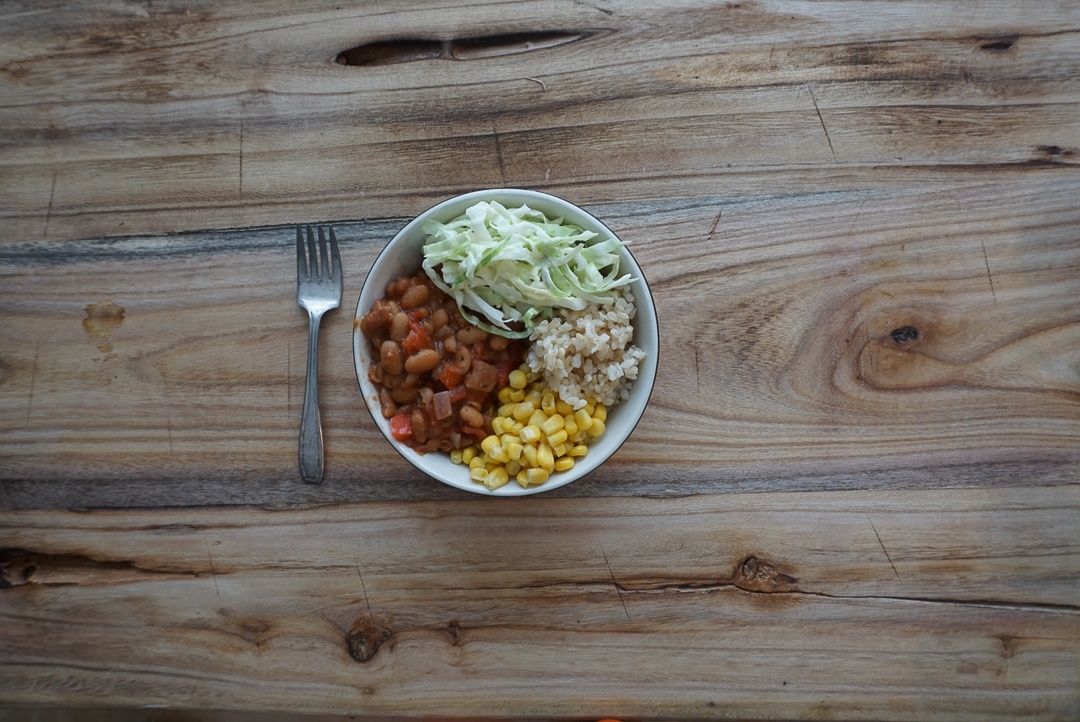 vegan chili bowl with corn and coleslaw