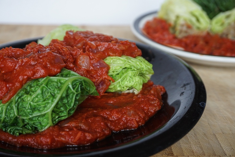 lentil and rice stuffed cabbage with cumin and tomato sauce