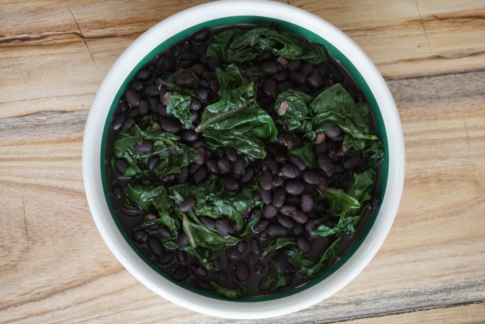 spicy black beans and collard greens plant based dinner