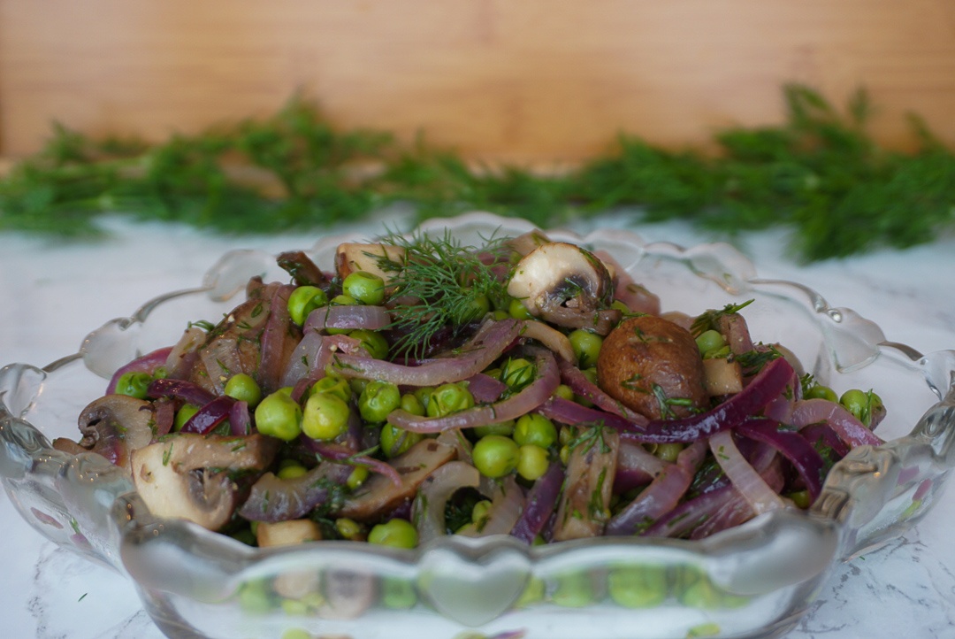 plant based spring pea salad with mushrooms and onions and dill