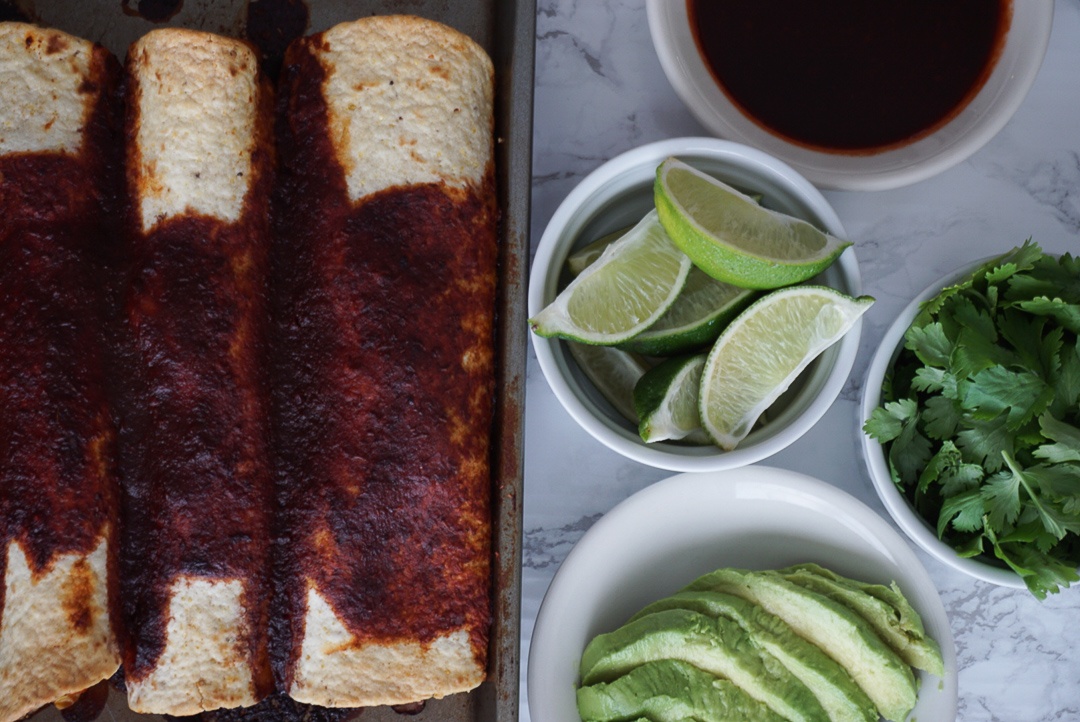 vegan bean enchiladas with lime avocado and cilantro